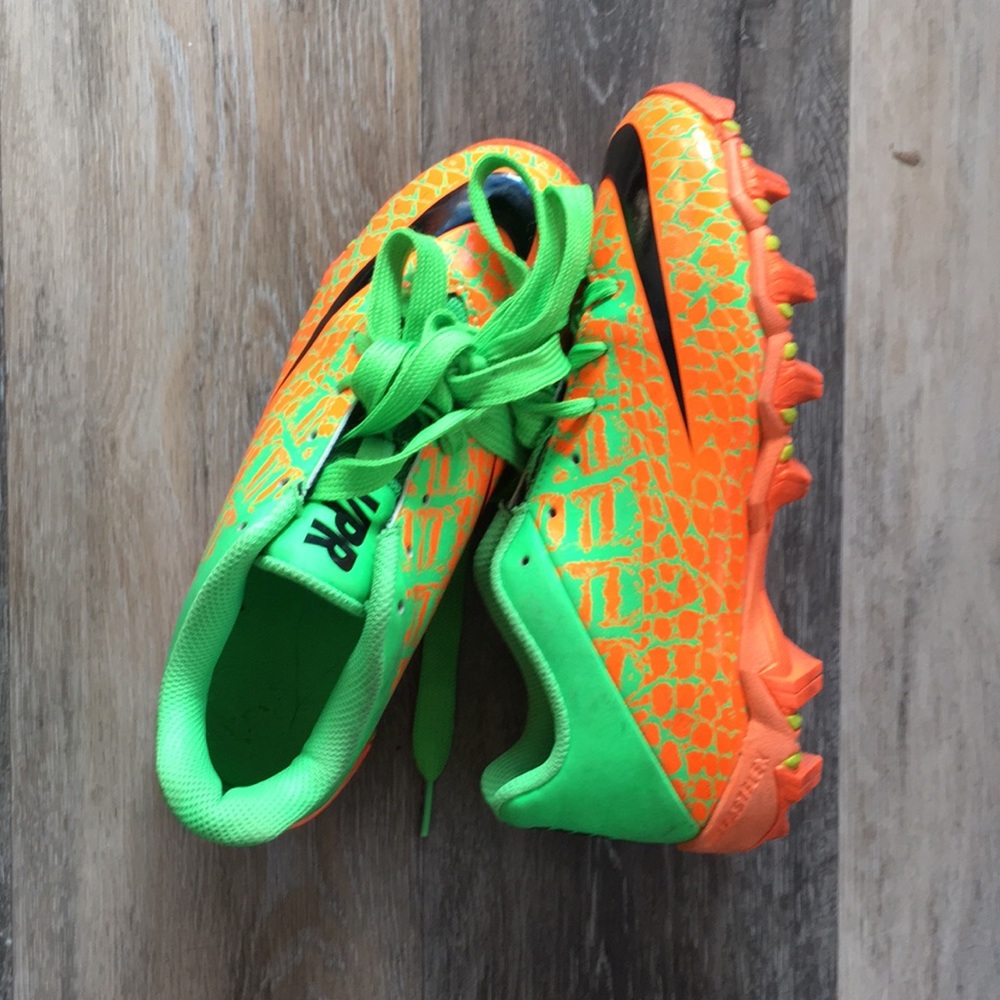 Nike cleats. 4Y, neon green and orange